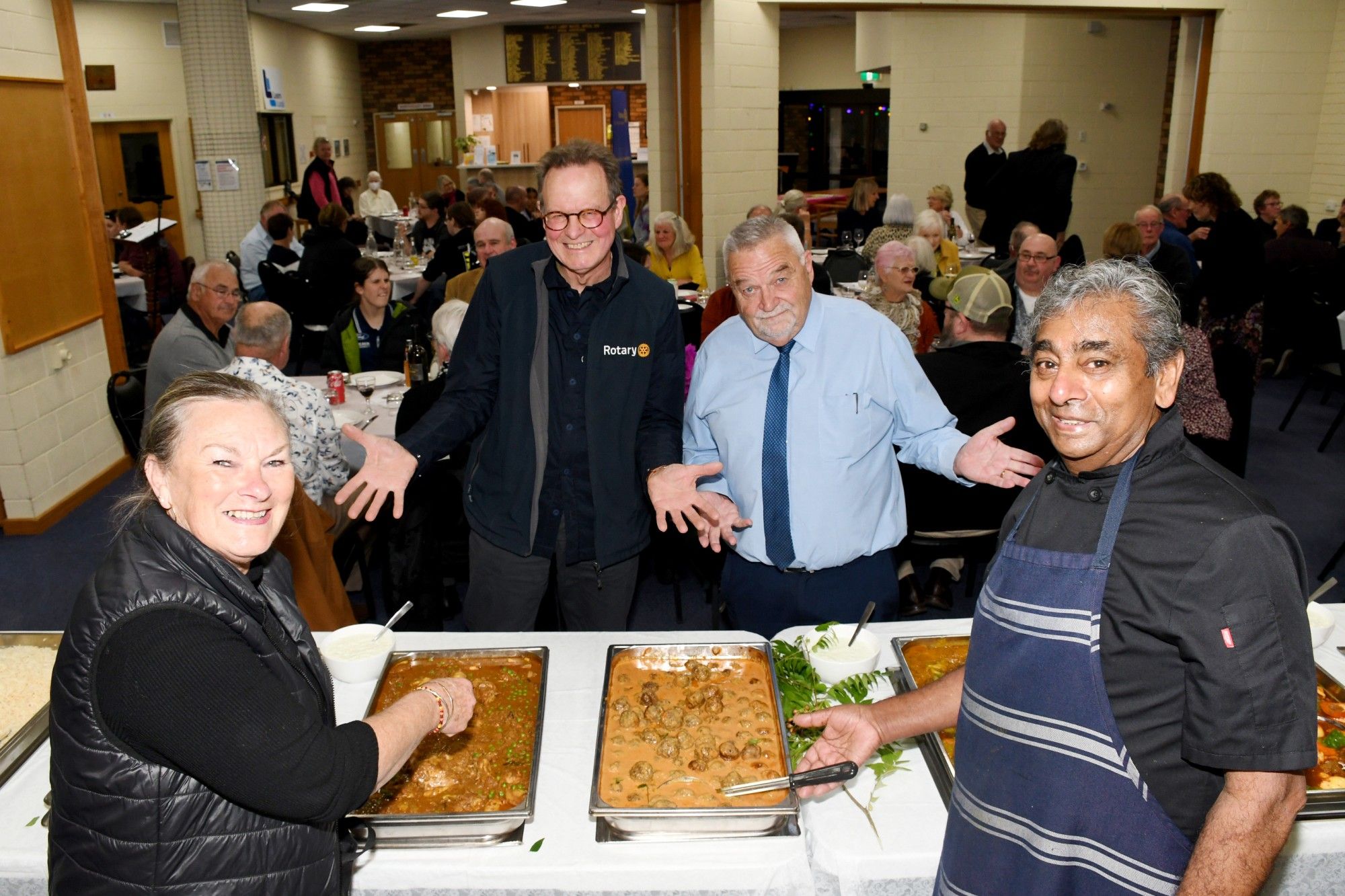 Dadswell Bridge Indian restauranteurs Laura and Noel Maslamoney prepare to feed the hoards as Rotary president John Tonkin and event organiser Bernie O'Connor check out the spread