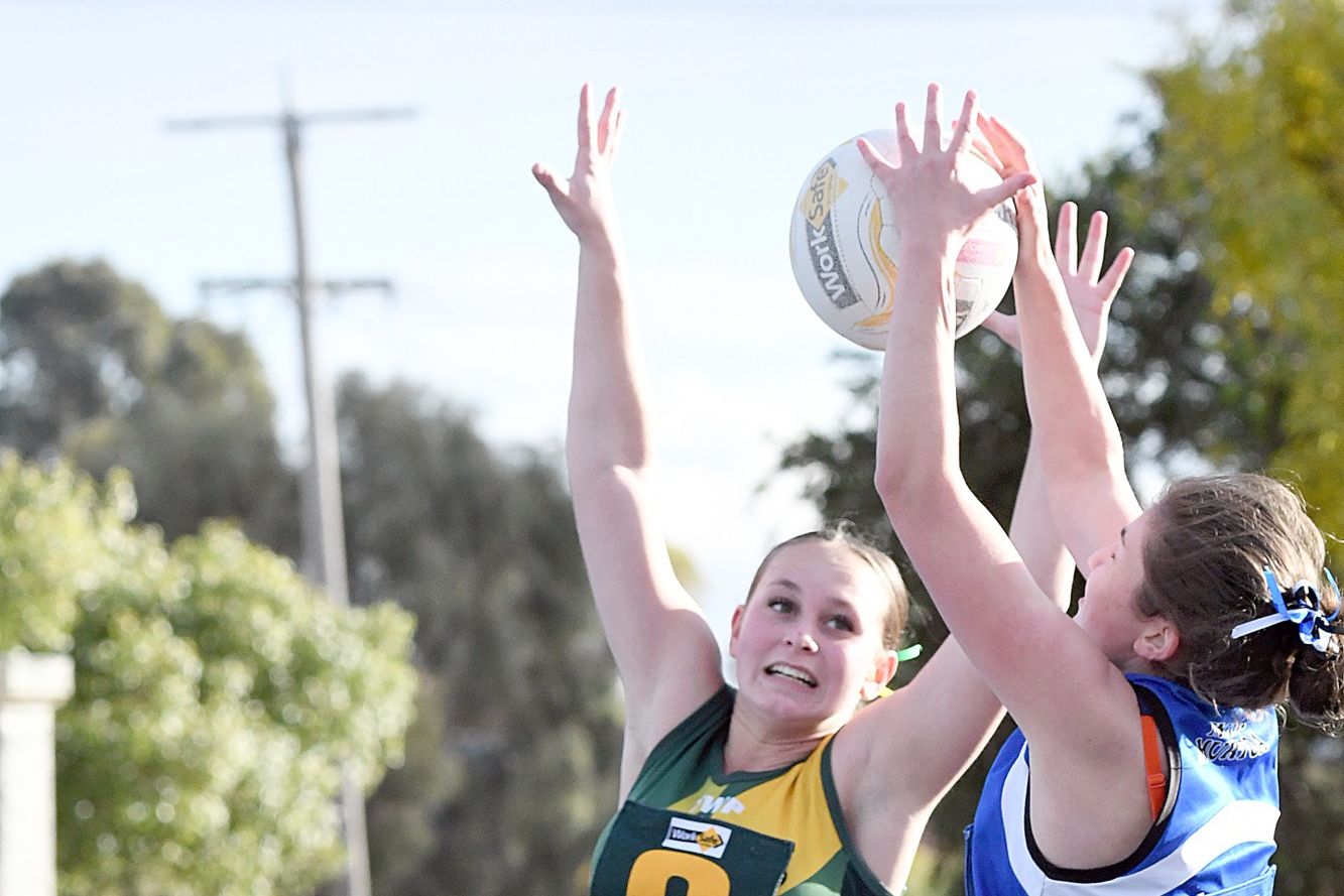 Dimboola centre Meleah Ylstra jumps in a contest with Minyip-Murtoa opponent Adele Reardon during Saturday's C Grade clash.