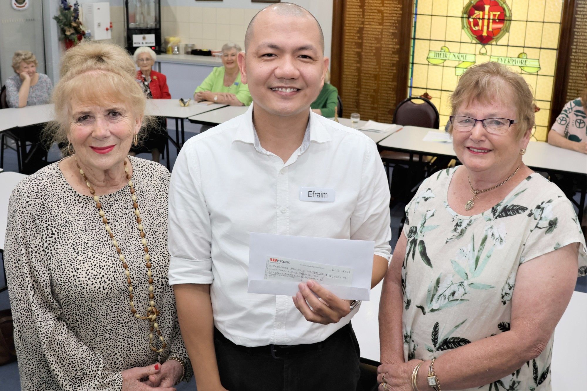 Opportunity Shop manager Dianne Lewis with Efraim Fajardo and Denise Queale.