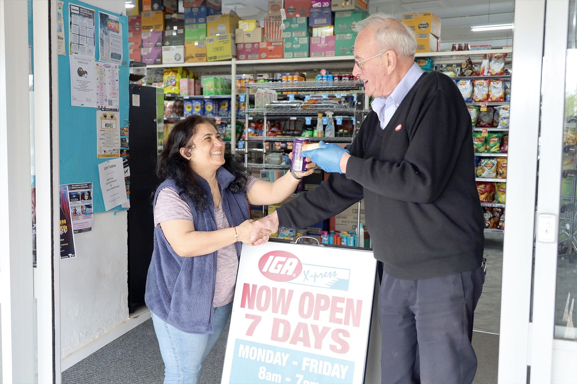 Mira Sanjay and Ian Turner celebrate a new beginning for Rainbow's IGA. Photo LES GRAETZ