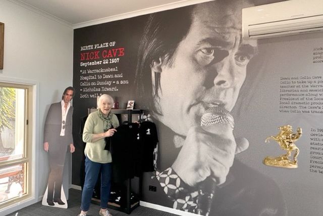Tourist Information Centre volunteer Judy Drage with Nick Cave's biographical details