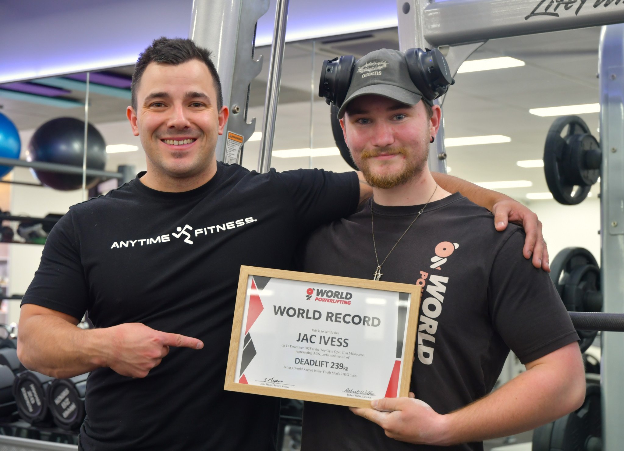 Coach Ben Hogan and Jac Ivess with his official world record certificate.