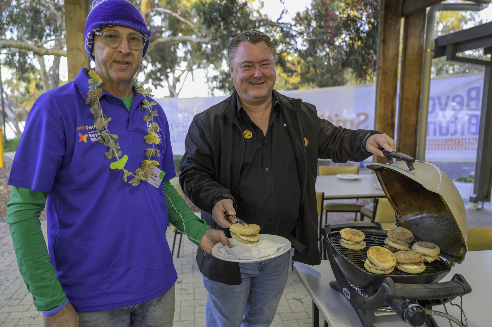 Brian Scheffers from Melbourne being served by Rotarian Scotney Hayter.