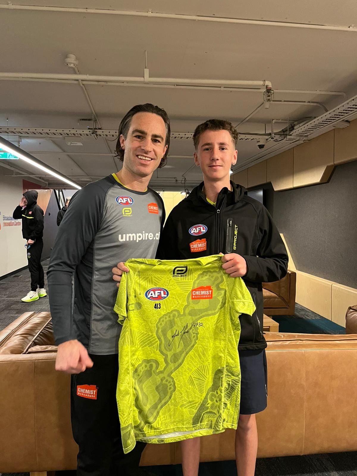 AFL umpire Jacob Mollison with Phoenix Hopper.