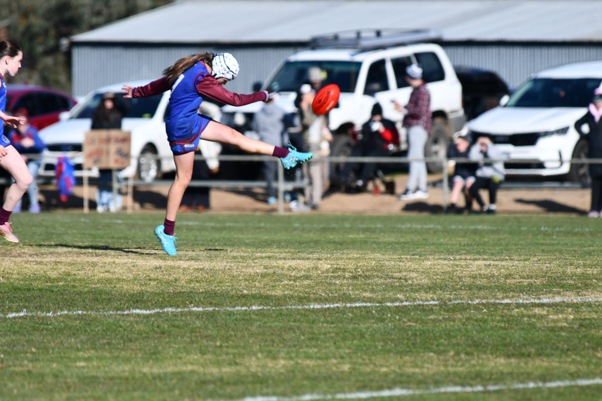 Horsham's Indigo Pope launches an upfield kick.