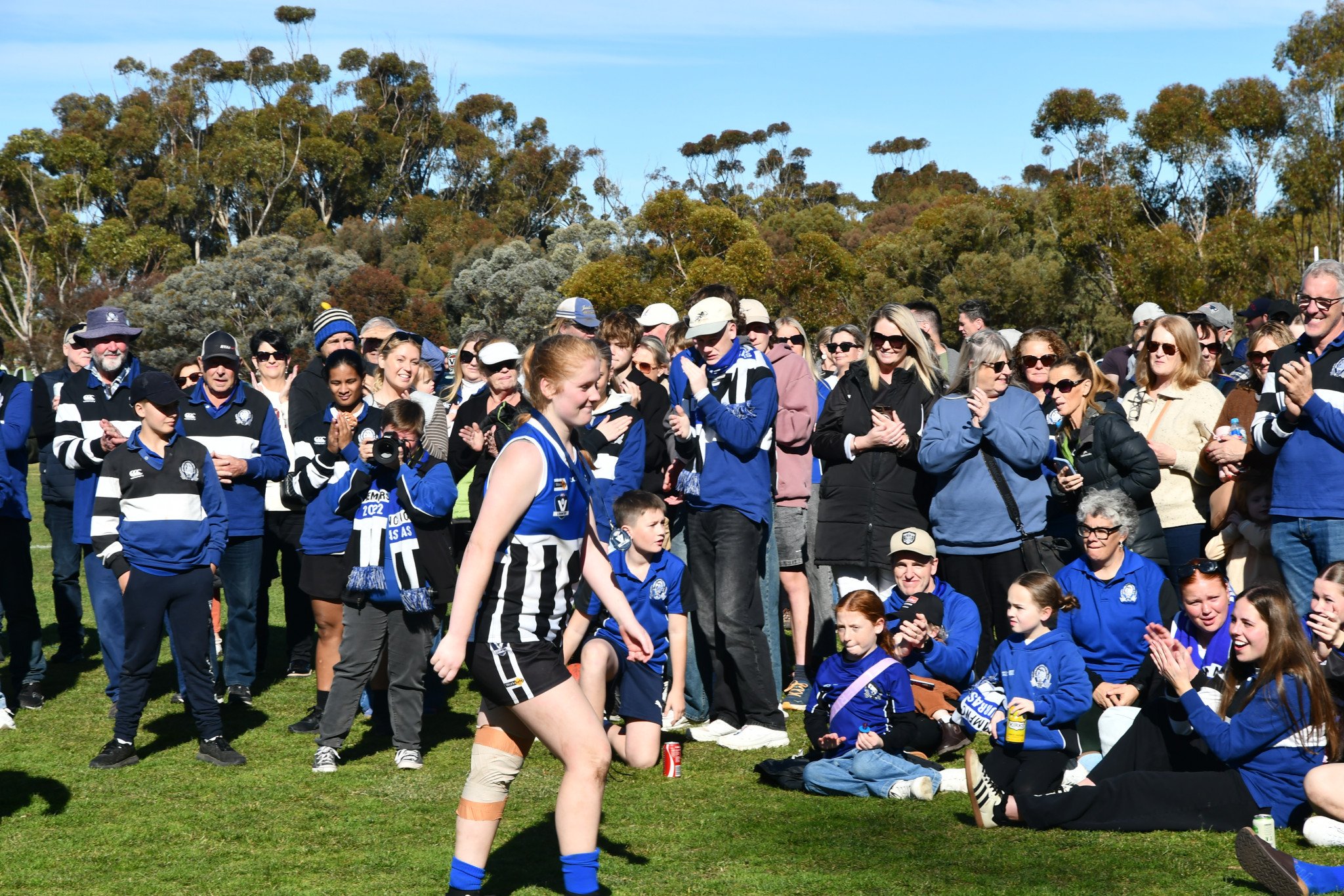 Ashlee Ison walks back to applause after receiving best on ground for her grand final performance.