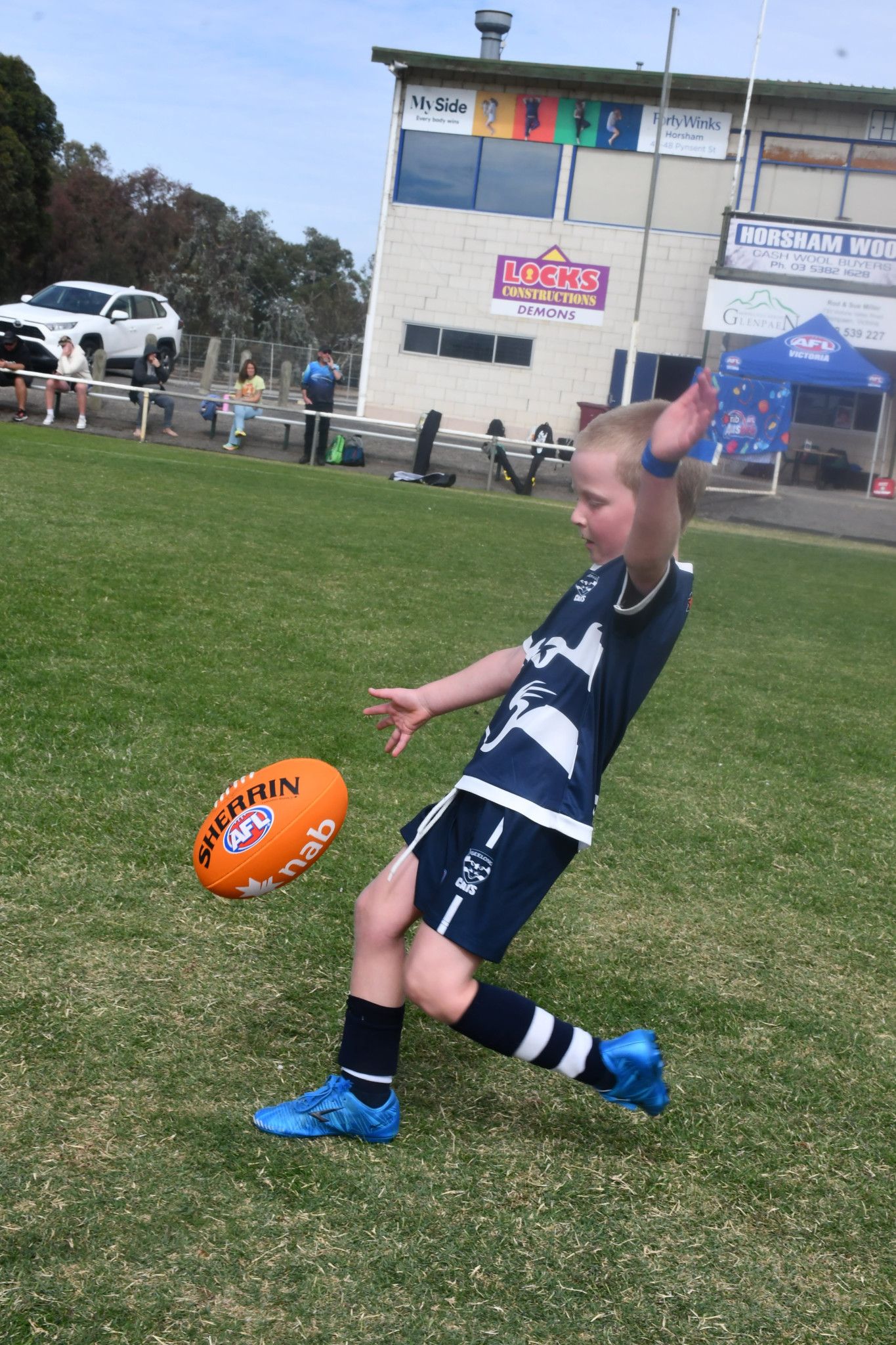 Archie, 5, of Horsham, kicking the ball.