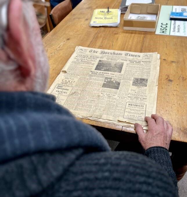 Horsham Historical Society president Rod Jenkinson looks at an old edition of The Horsham Times, which would later merge with The West Wimmera Mail to become The Wimmera Mail-Times. Picture by Ben Fraser.