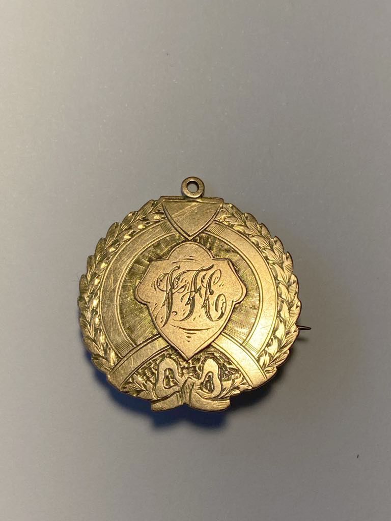 The front of the nine-carat Rowe Football Trophy medallion won by Ben Smith of Ellam in 1910. It has the letters 