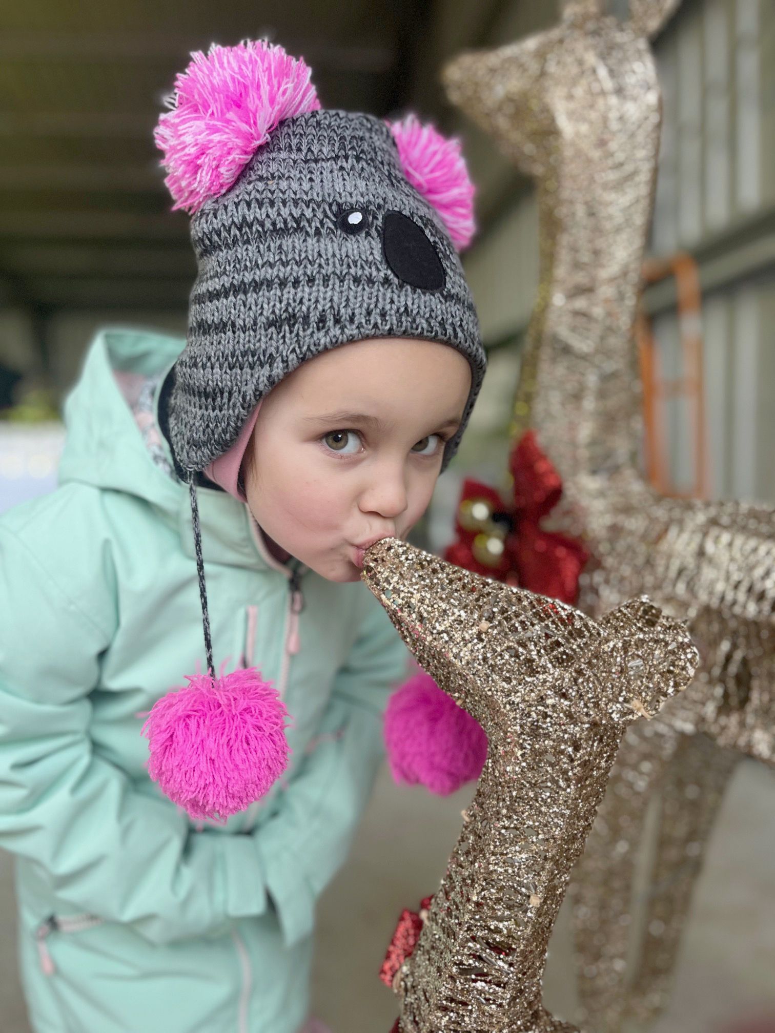 Four-year-old Rahni Bunting from Horsham gives a baby reindeer a kiss.