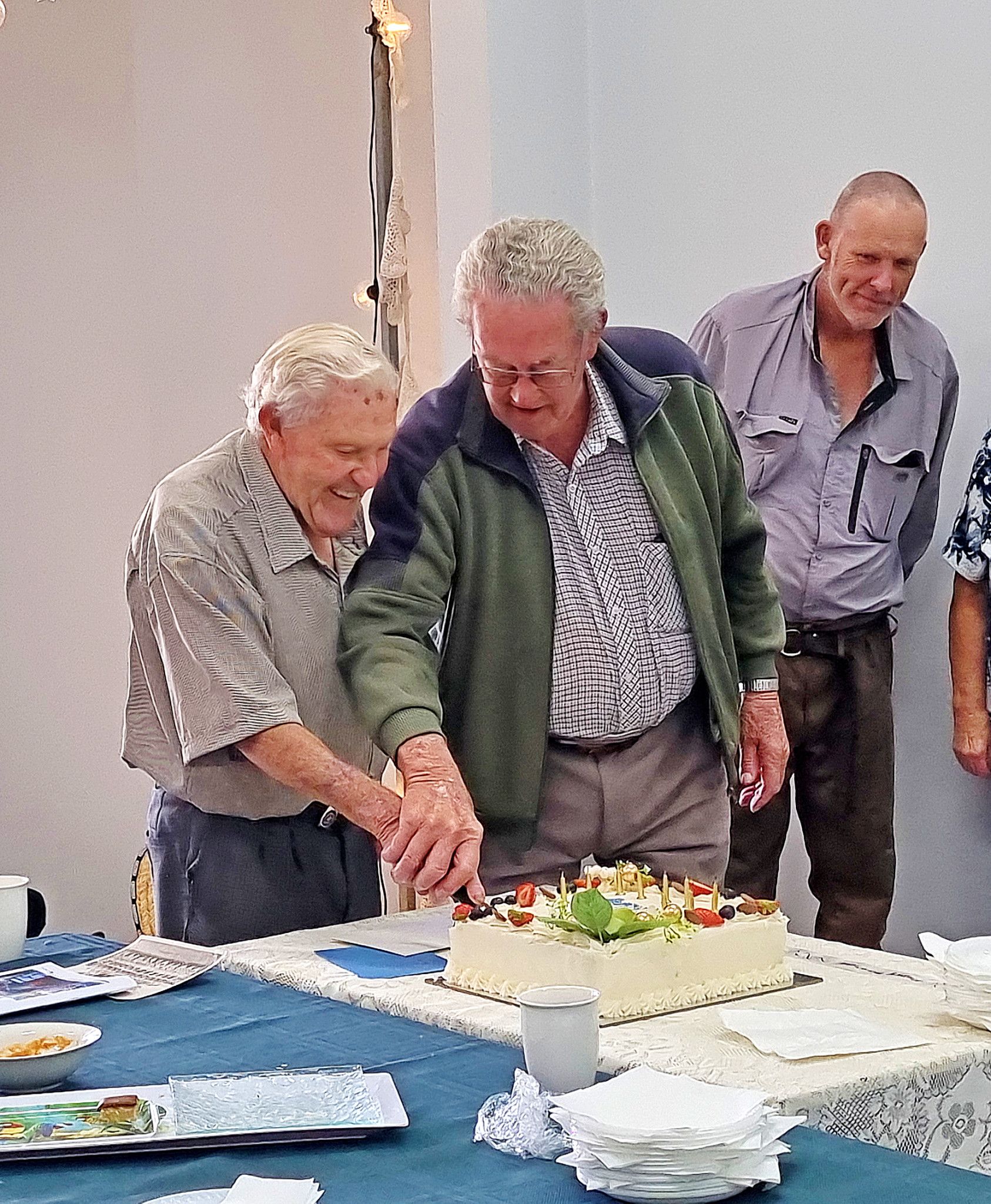 Ian Ballinger, left, cutting his 90th birthday cake with Floss Bibby at the Wheatlands Agricultural Museum on March 22. The pair completed their National service together.