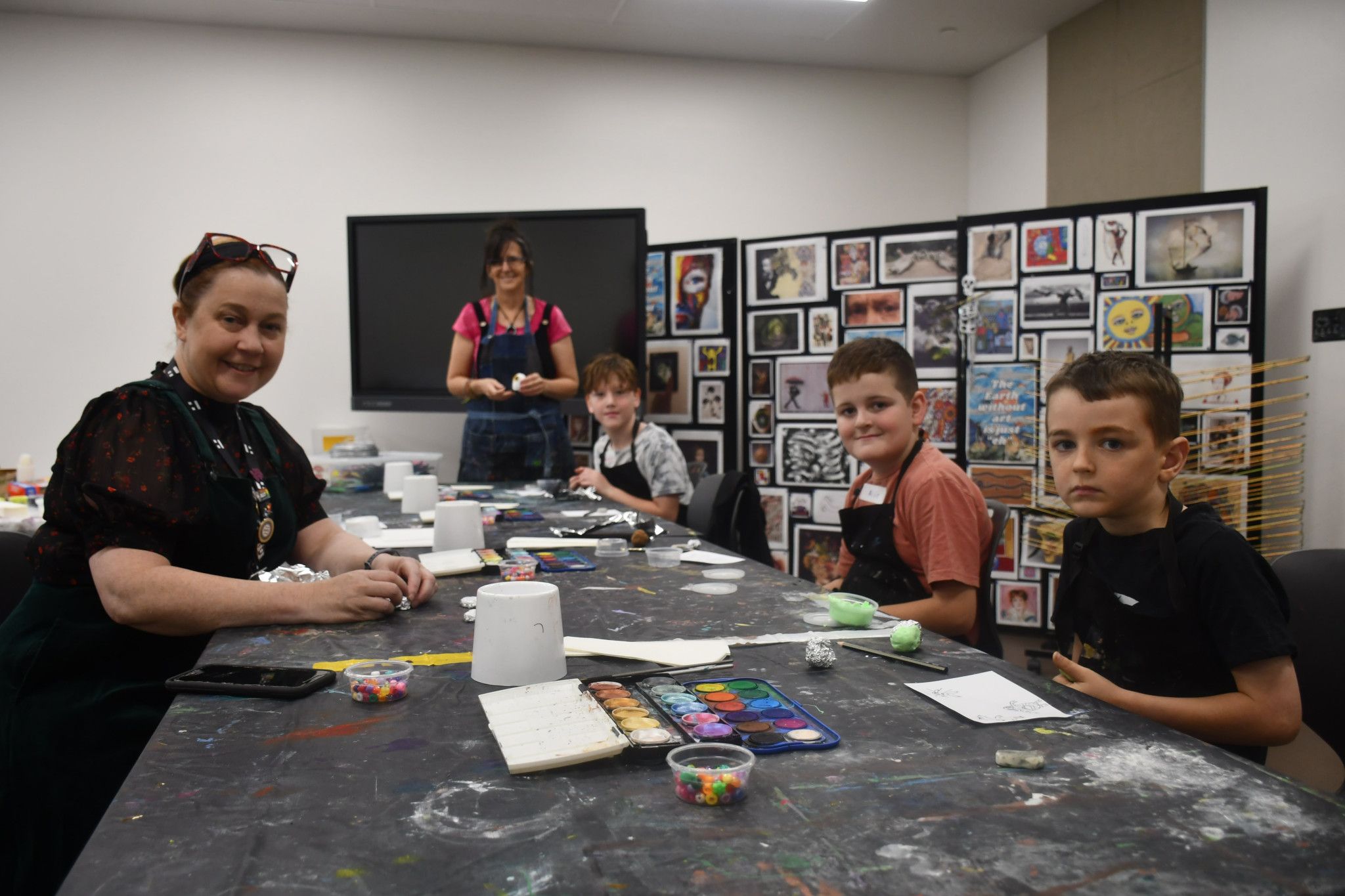 Horsham Town Hall public art officer Larissa Riddell and arts tutor Michelle Watson with local kids Jaxon, 7, Alfie, 10, and Xavier, 7.