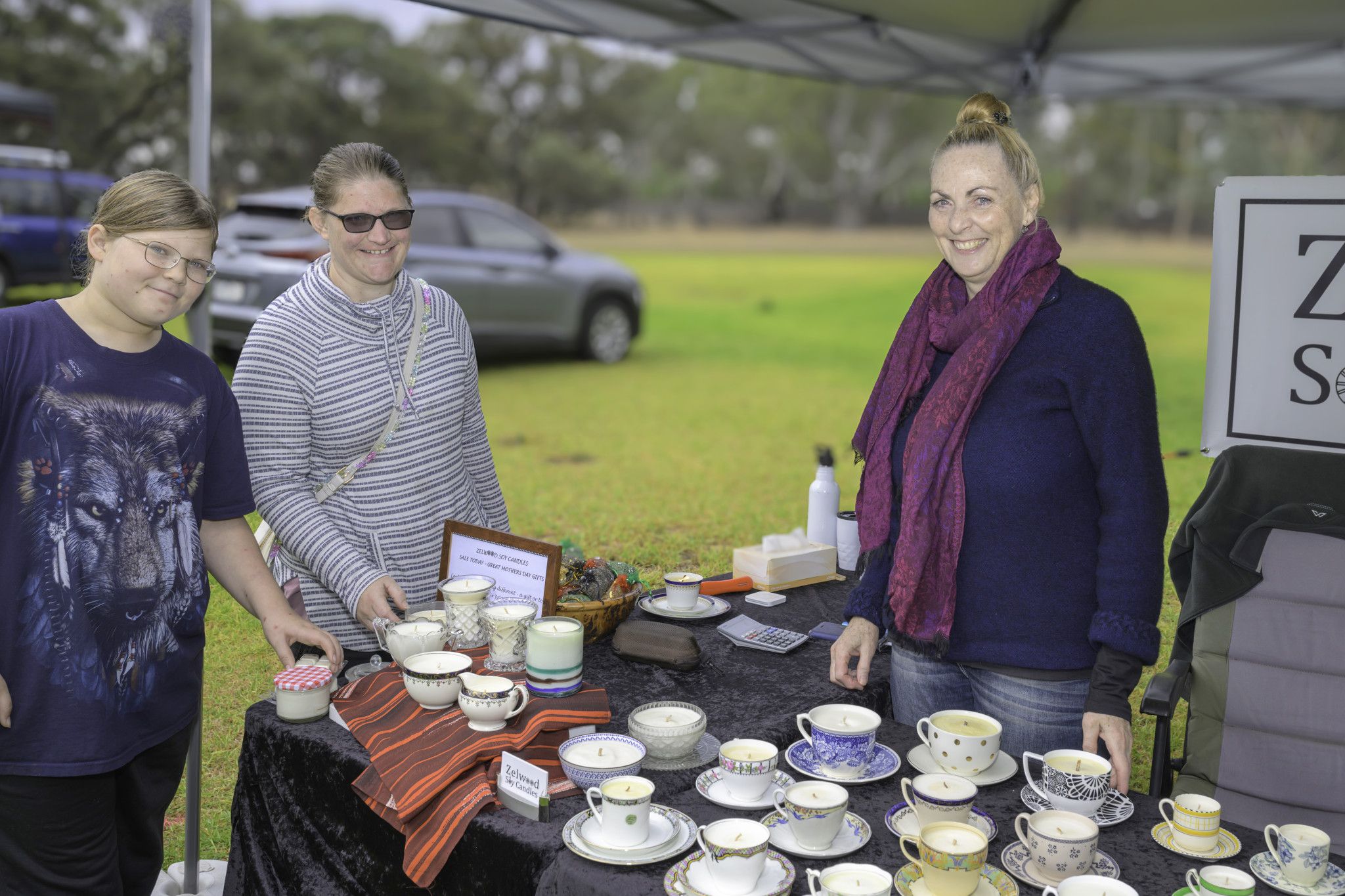Lucy Krelle on her Zelwood stand, attends to Tarsh Goder and Emily Wilhelms.