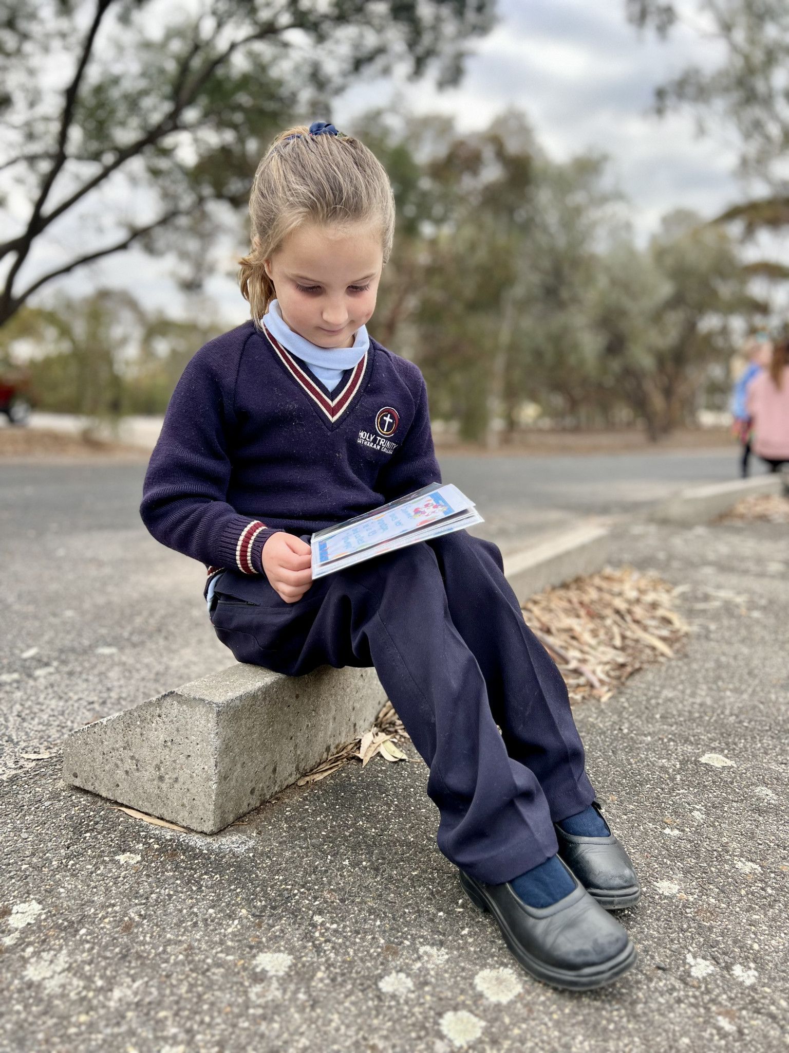 Summer, 6, looked at notes in her diary before walking to school on Friday, celebrating Walk Safely to School Day.