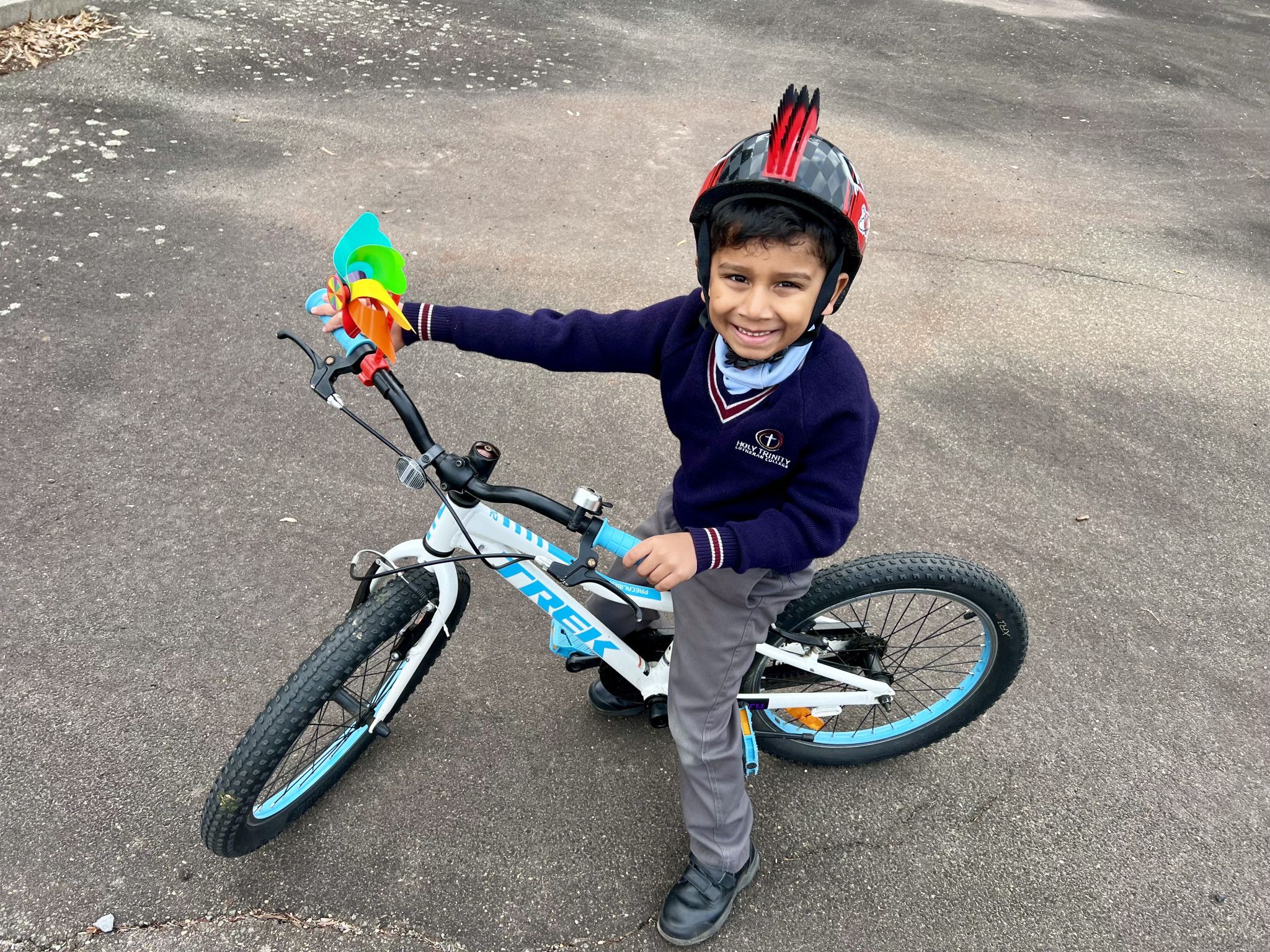 Aadav, 6, riding his bike with a fantastic helmet.