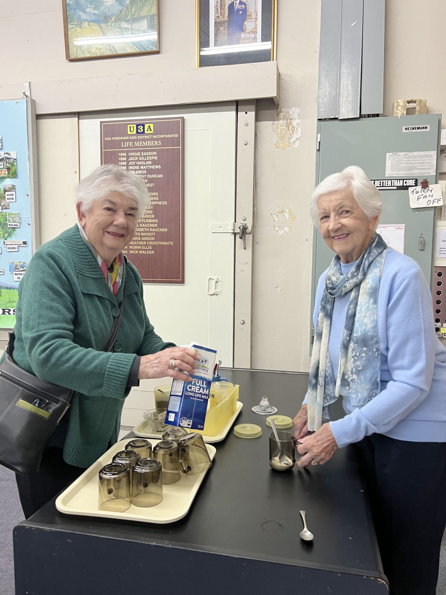 Beryl Lampard and Fay Pearson making tea for themselves during the event.