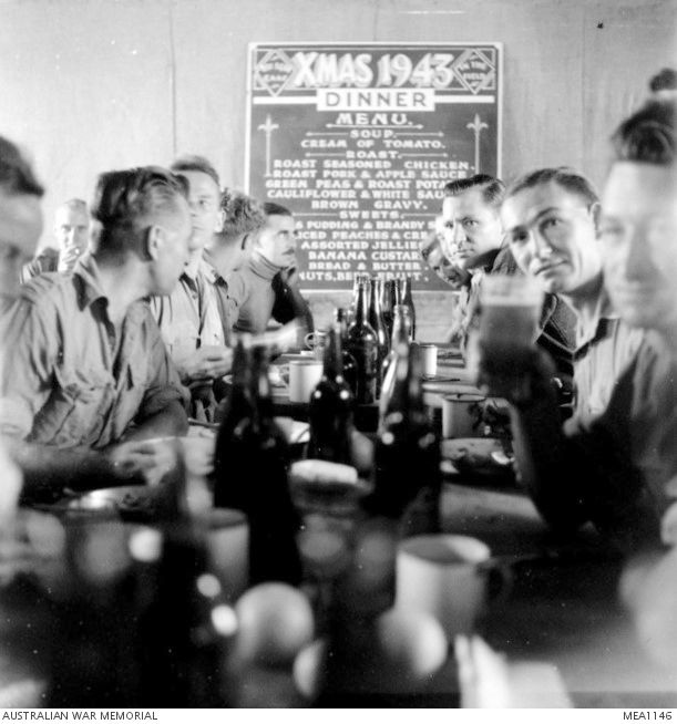 In El Daba, Egypt, members of No 451 (Spitfire) Squadron, RAAF, sit down to Christmas dinner on December 25, 1943.