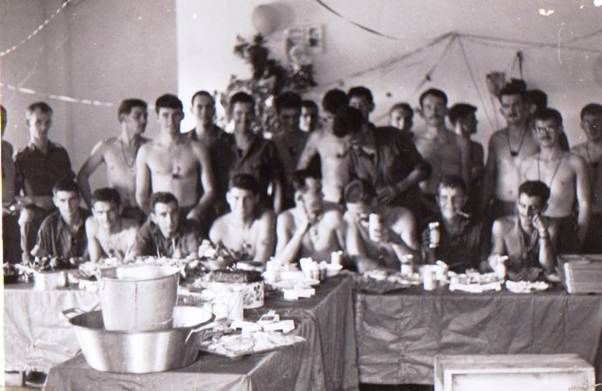 The Reconnaissance Unit at Binh Ba, Vietnam, gathers for Christmas in 1966.