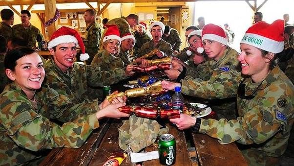 Australian soldiers from Mentoring Task Force Three enjoy time out for Christmas lunch at Tarin Kot, Afghanistan, in 2011.å