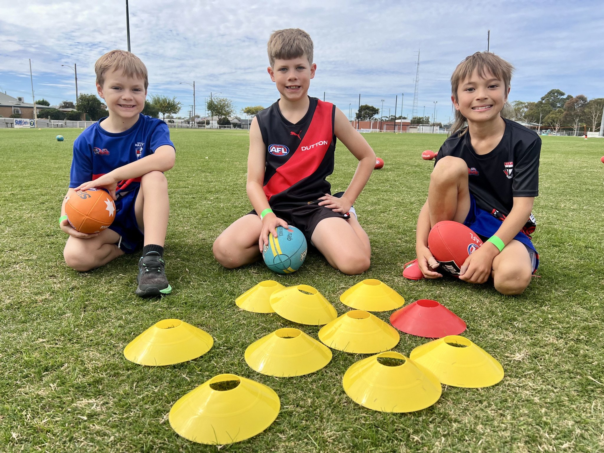 Horsham 8-year-olds Ryder, Harry and Kota are pleased after collecting plenty of coins (cones) during the Horsham School Holiday Program activity.