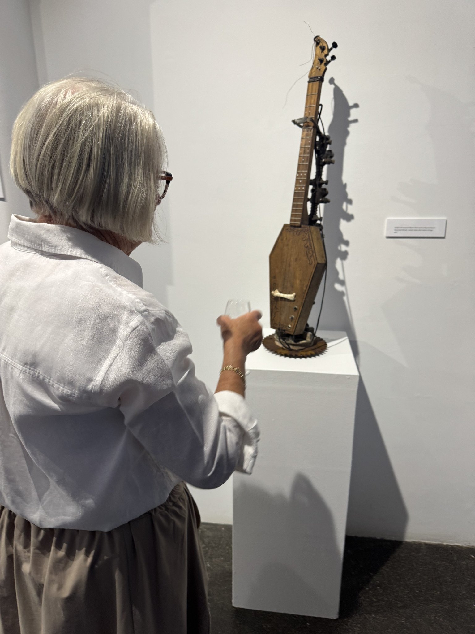 Helen Fisher looking at one of the sculptures in the exhibition.