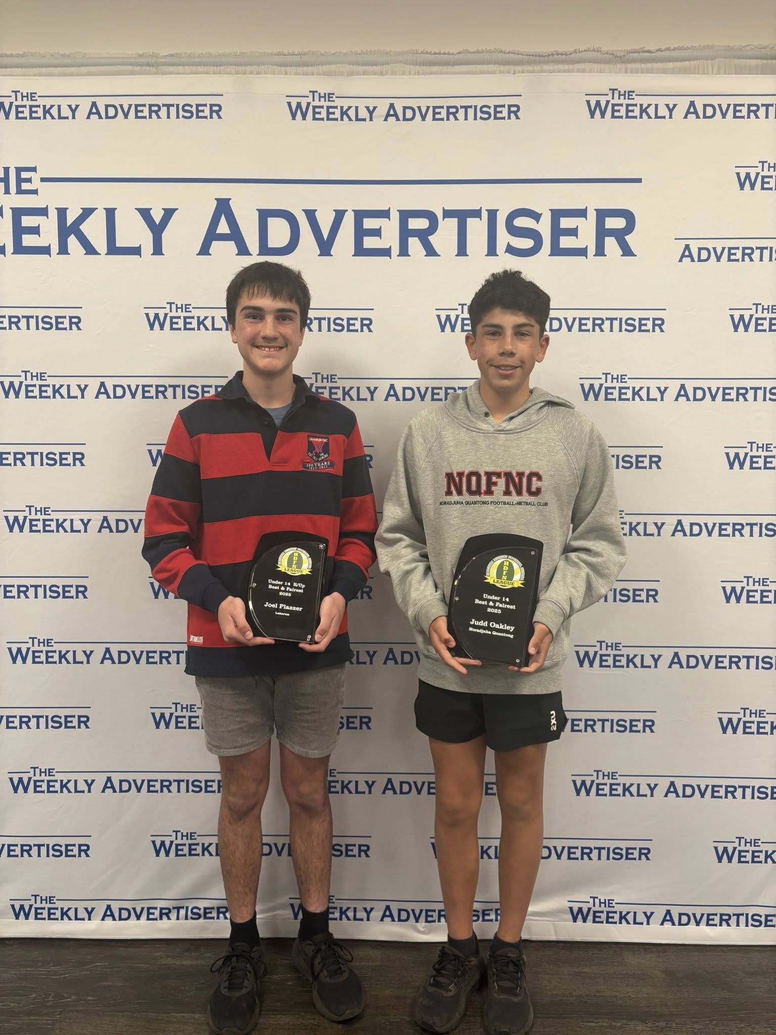 Laharum's Joel Plazzer and Noradjuha Quantong's Judd Oakley with their respective under 14s football runner-up and best and fairest awards.