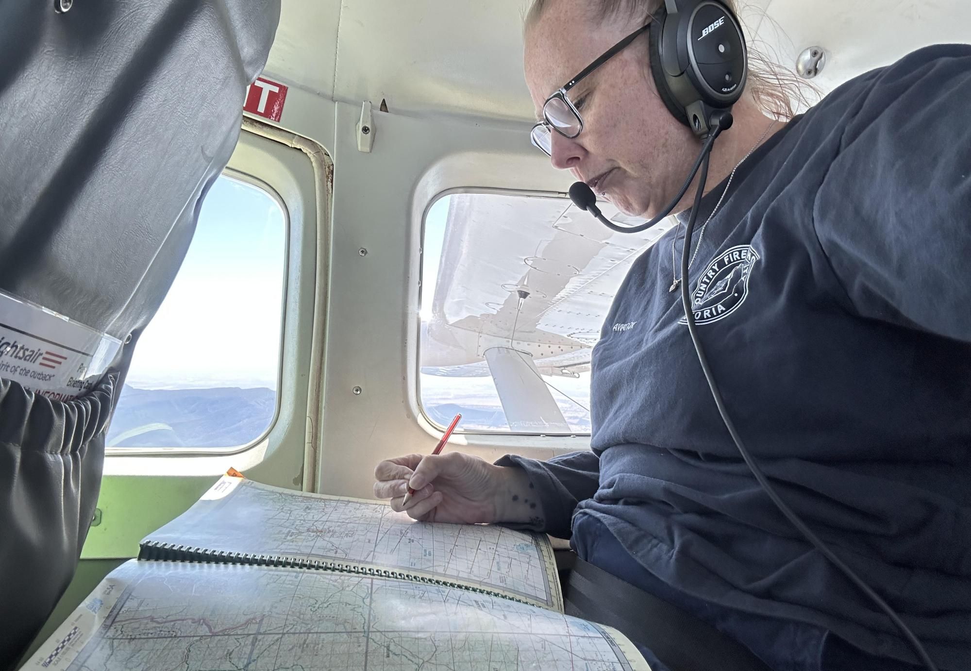 Kate Wills received her wings as a Country Fire Authority Air Observer in Spepteber 2024 and spends time in the air mapping, assessing fire behaviour and many other duties. Picture supplied