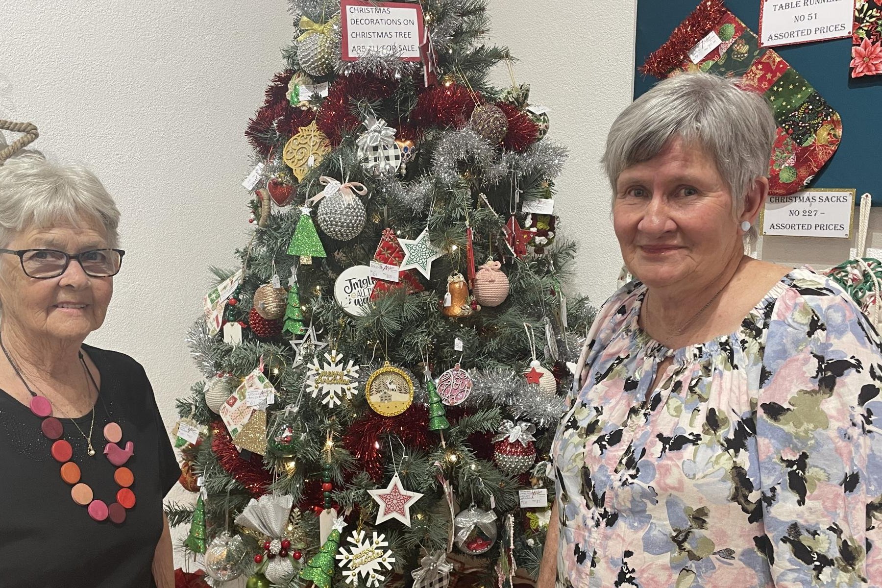 Alison Norton and Liz Minne with the Christmas Tree in the Makers Gallery and Studio. Decorations on the tree are for sale. Picture by Sheryl Lowe