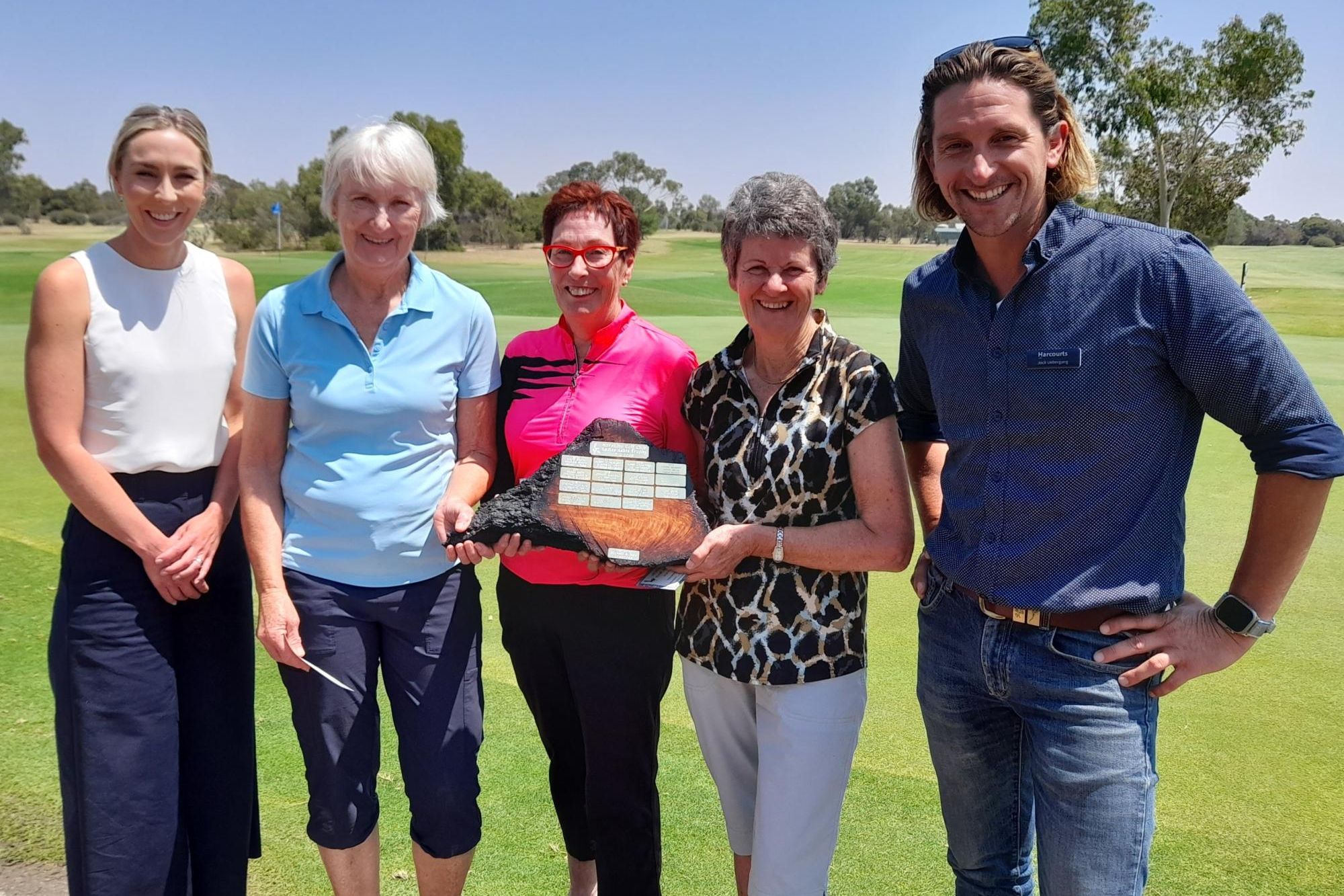 Nicole, left, and Jock Uebergang, right, present Robyn Watts, Helen Burke and Marge Rich with the Horsham Golf Club's Ashes Trophy on February 6. Picture supplied