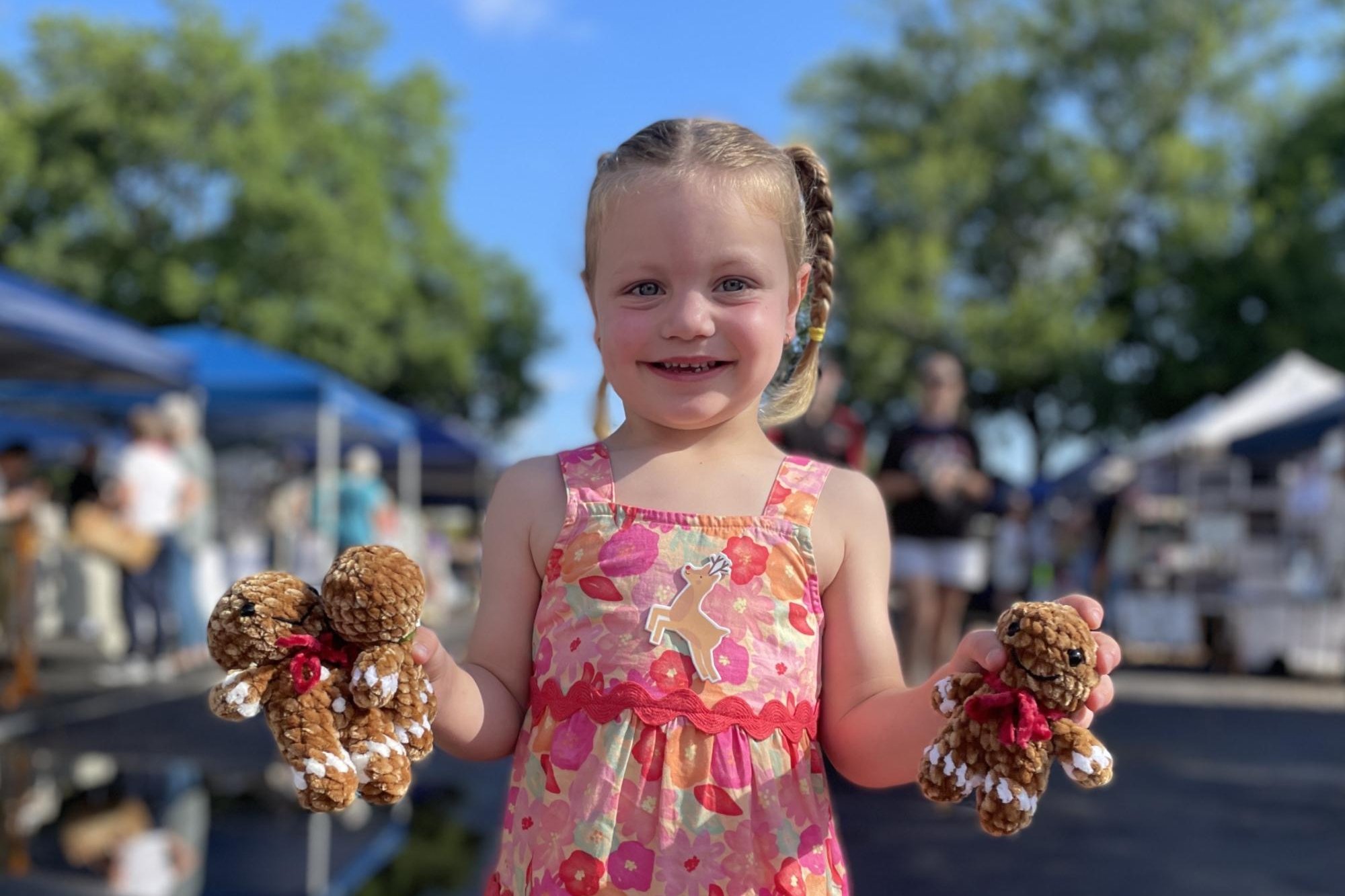 Evie Osbourne shows off her handmade toys at the Horsham Makers Gallery Christmas markets on Saturday, December 7. Picture by Lucas Holmes