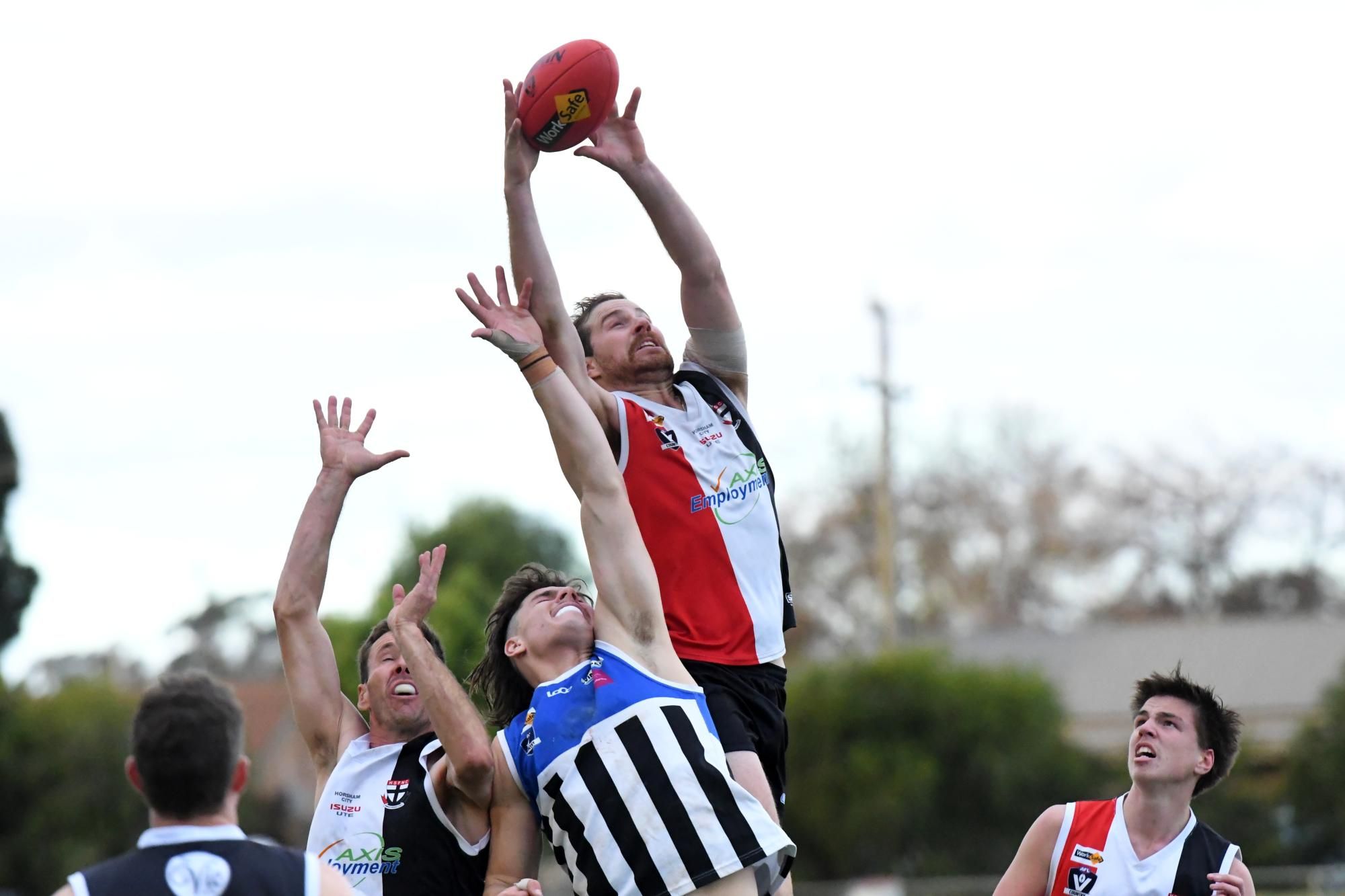 Horsham Saints captain Angus Martin takes a contested mark against Minyip Murtoa on Saturday, June 1. Picture by Lucas Holmes