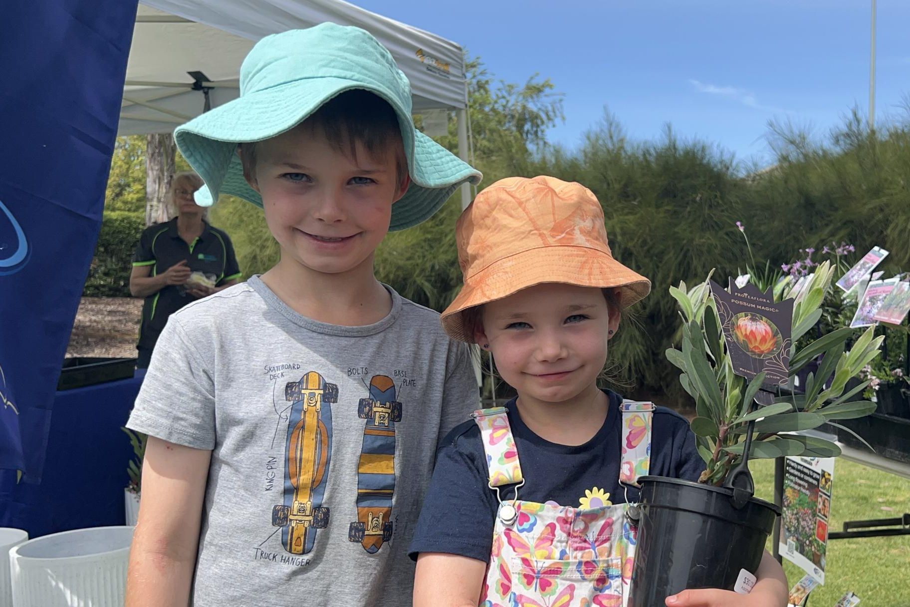 Parker (7) and Kobie Stonehouse (5) show off the new plant they got at the Horsham Spring Garden Festival. Picture by John Hall