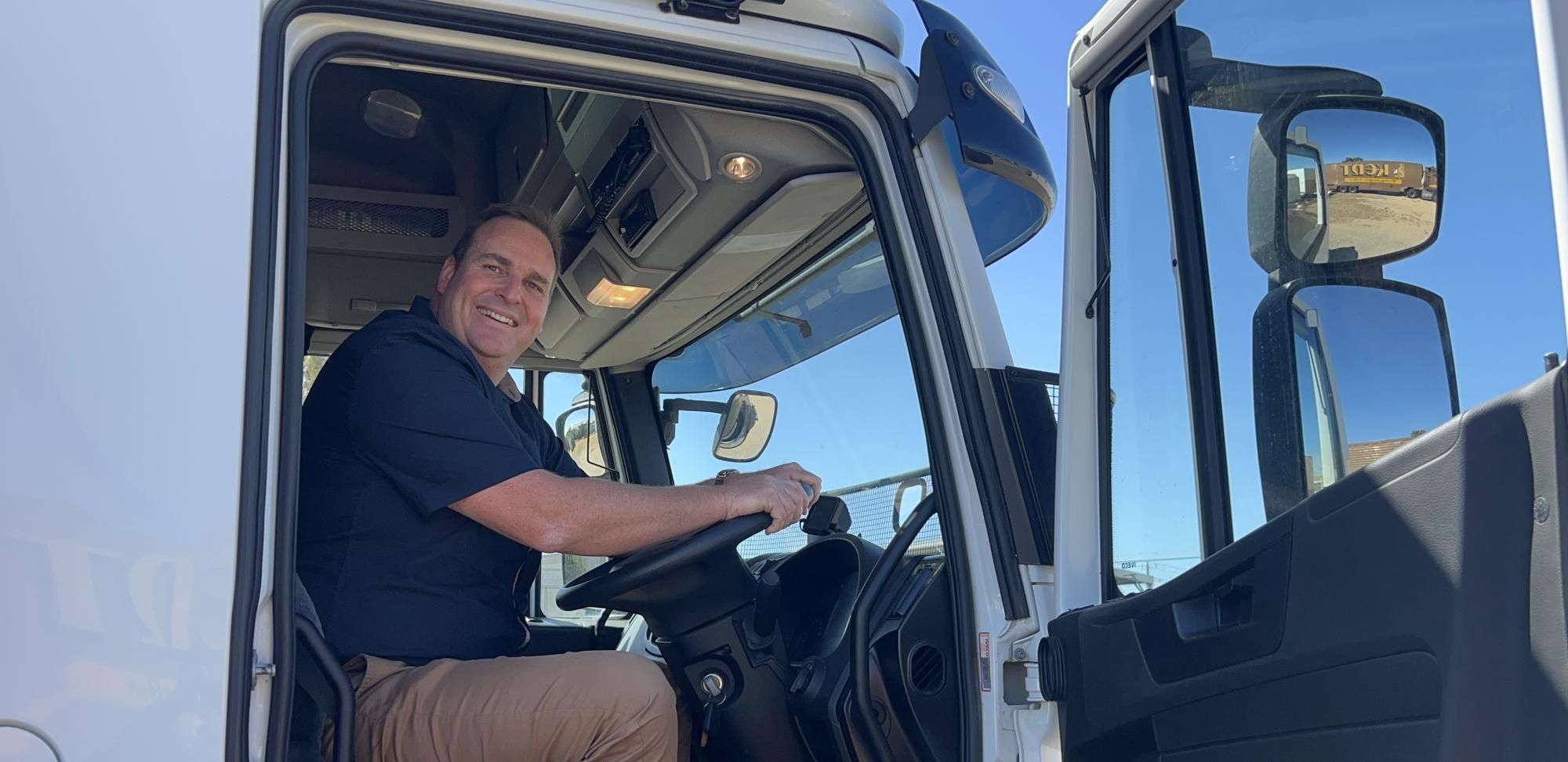 Llewelyn Clark shows off one of his recently upgraded trucks used by Clarks Furniture's removals business. Picture by John Hall