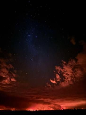 The red glow from the Little Desert fire lights up the clouds in the night sky over Nhill. Picture Chloe Stephens