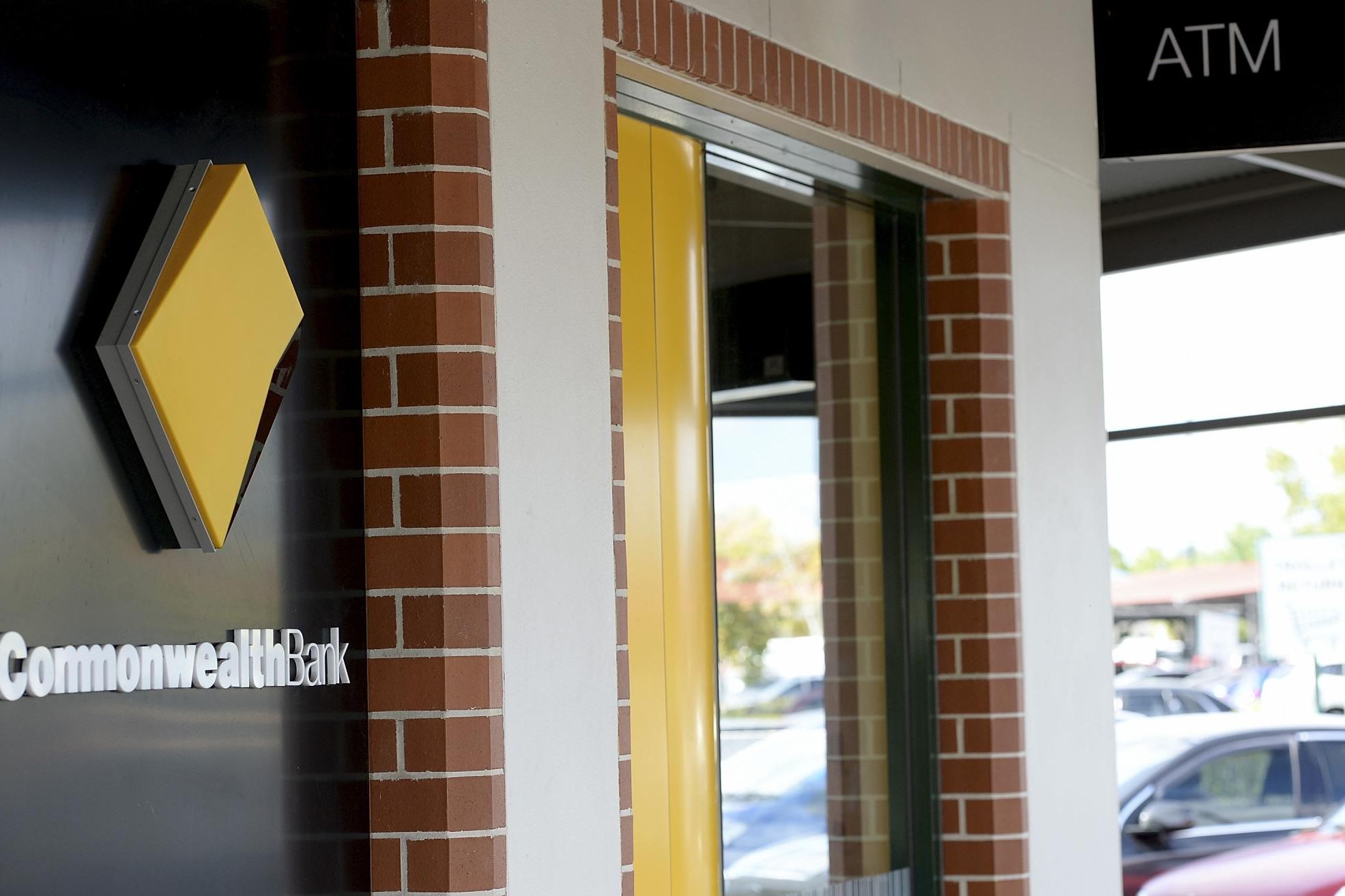 The Commonwealth Bank's plan to charge customers to withdraw their own money has been linked to branch closures. Picture by Bradley Kanaris