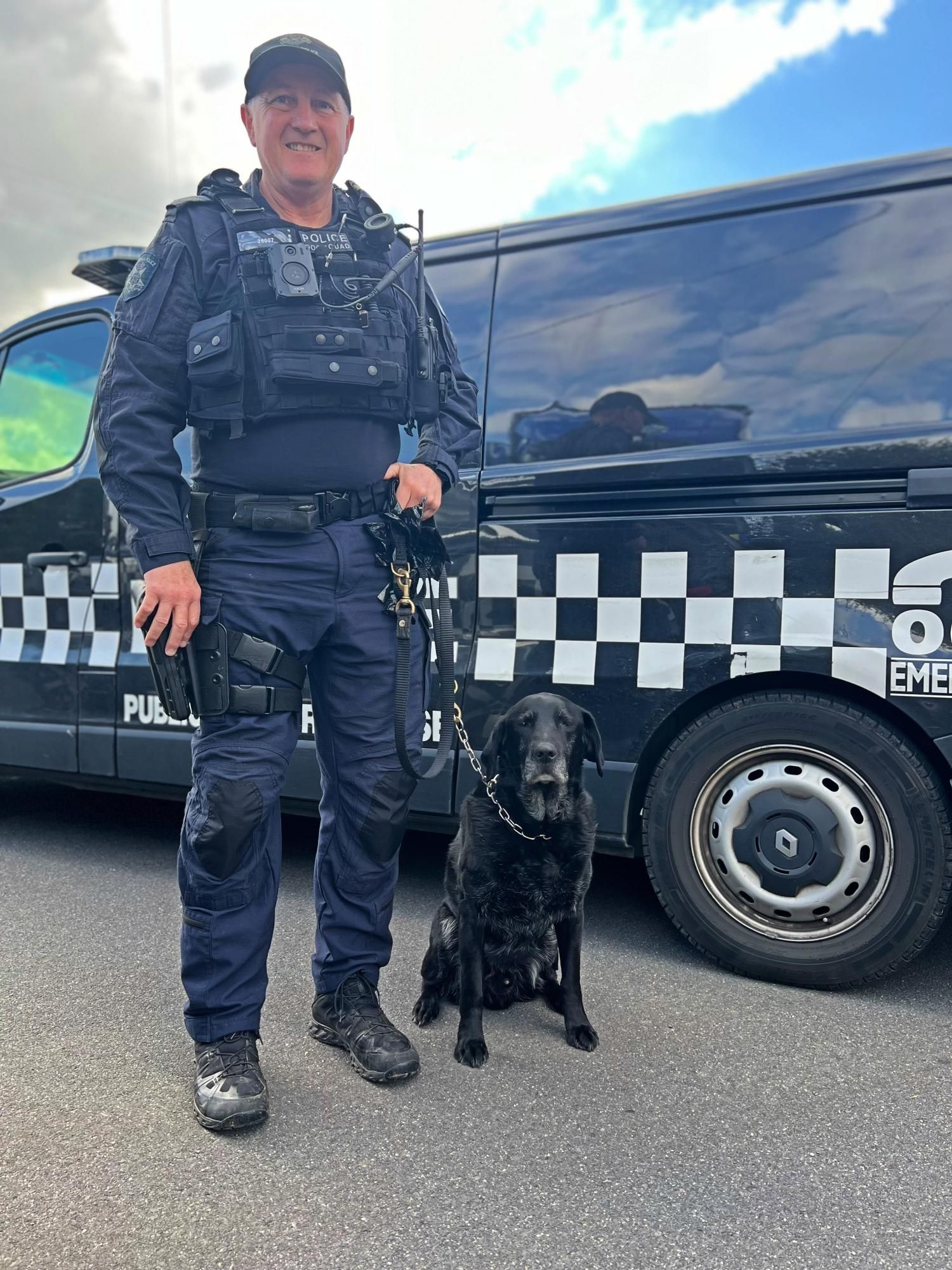 Leading Senior Sergeant Andrew Adam with police dog wilbur of the dog squad. Picture by Ben Fraser
