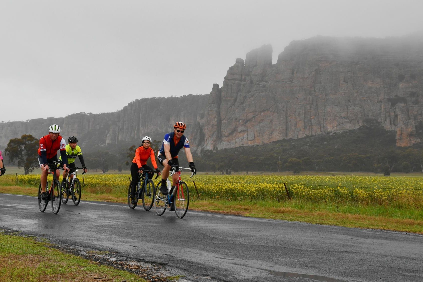 ACE Riders pedal past Mount Arapiles in light rain. Picture by Alan Joyce