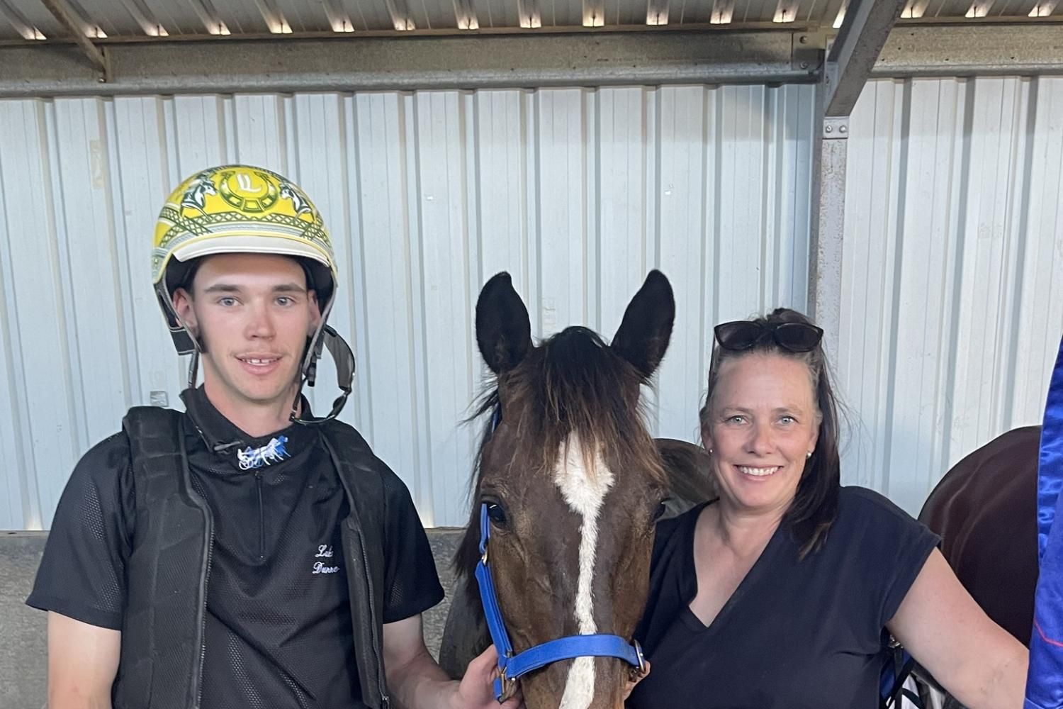 Driver Luke Dunne, left, and owner-trainer Marnie Bibby with seven-year-old gelding Swiss Lightning after their recent win at Horsham. The in-form duo will saddle up Starzinhereyes at Ararat on Monday in the final event of the afternoon. Picture supplied