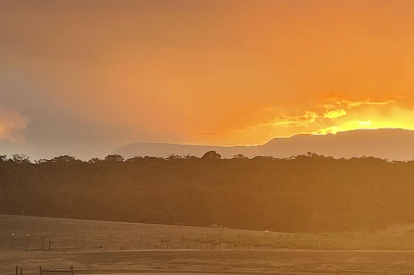 A view of the sun setting on Rhymney as the bushfire burns in Mafeking. Picture supplied