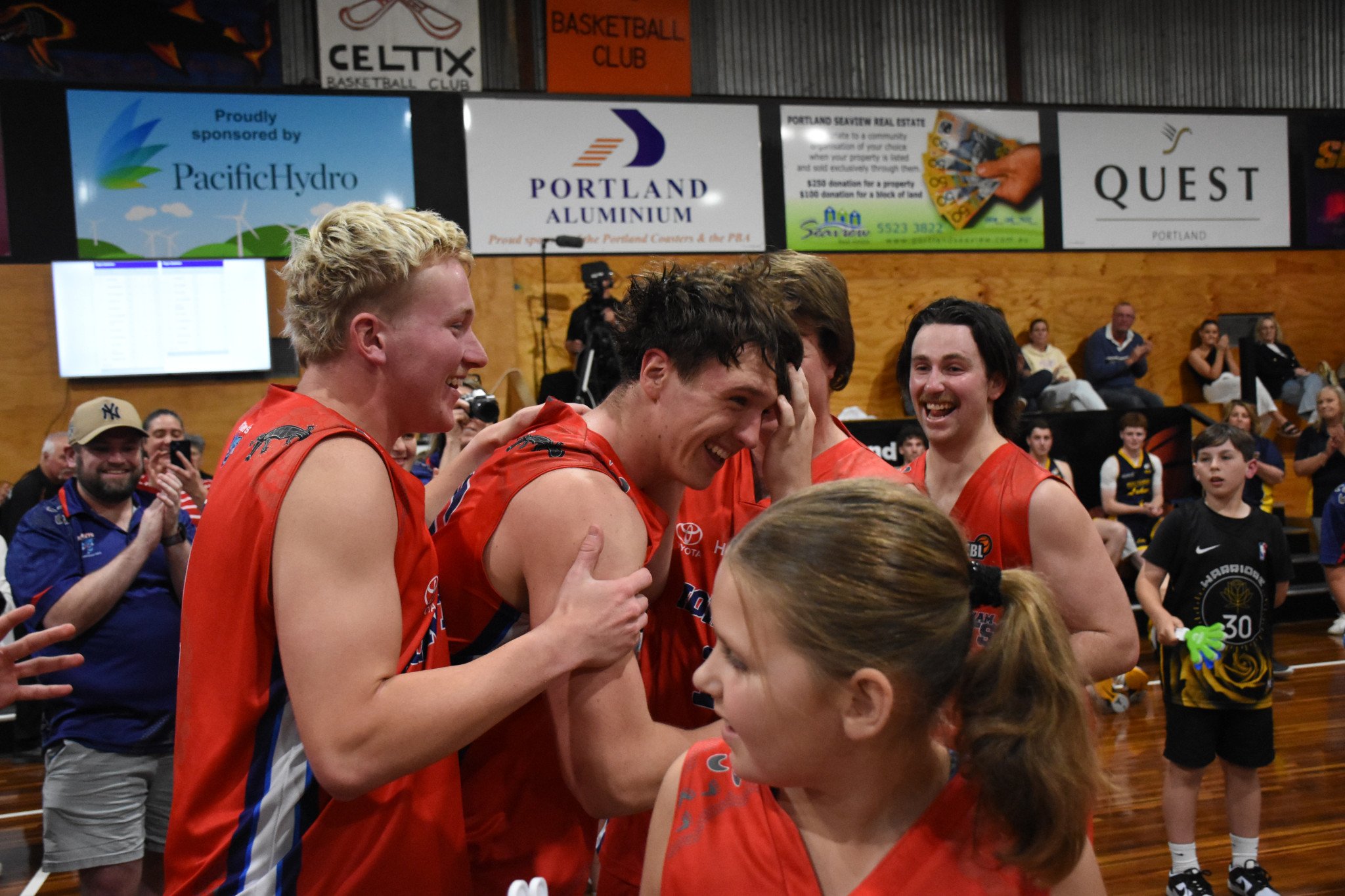 Tarkyn Benbow congratulates Micah. PHOTO: CHRIS GRAETZ