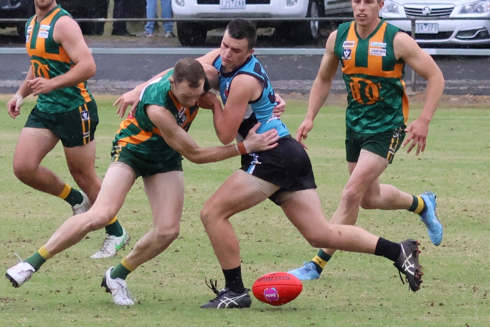 Dimboola coach Andrew Moore battles for posession of the ball with Southern Mallee Thunder's Jackson Moore.