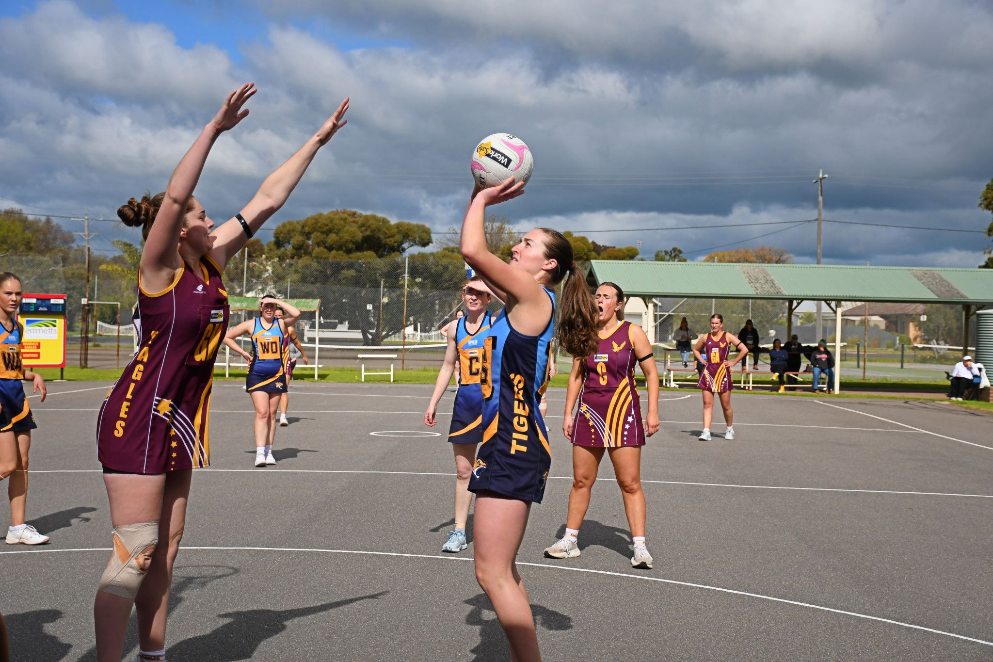 Nhill's Ruby James puts up a long shot while under pressure from Warrack Eagles' Jordan Heller. Both were named best on court in the 48-48 draw.