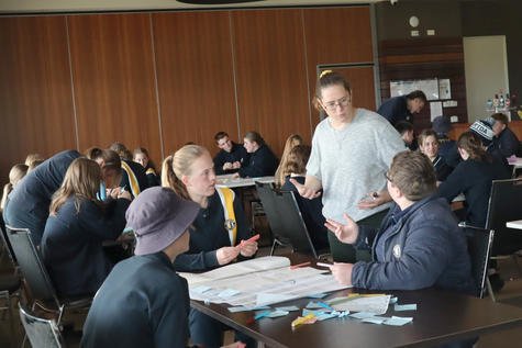 Crazy Ideas College facilitator Jenny Turnham works with students.