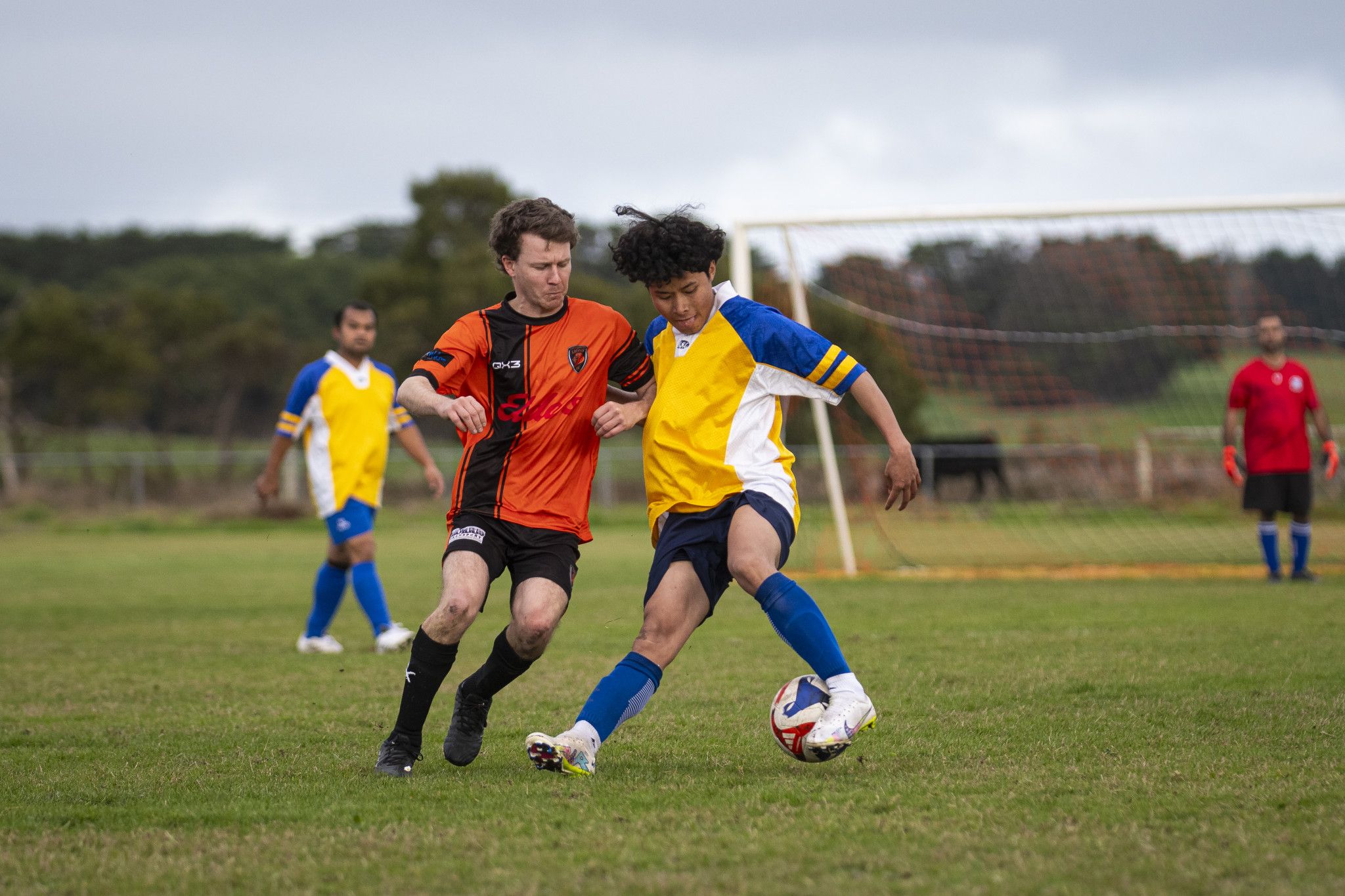 Falcons' senior player Pway Nay Kaw Wah trying to break a tackle.