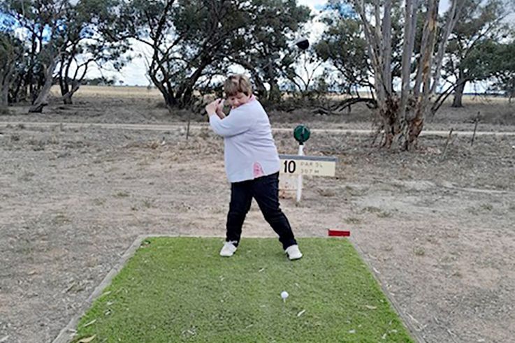 Bev Appledore tees off.