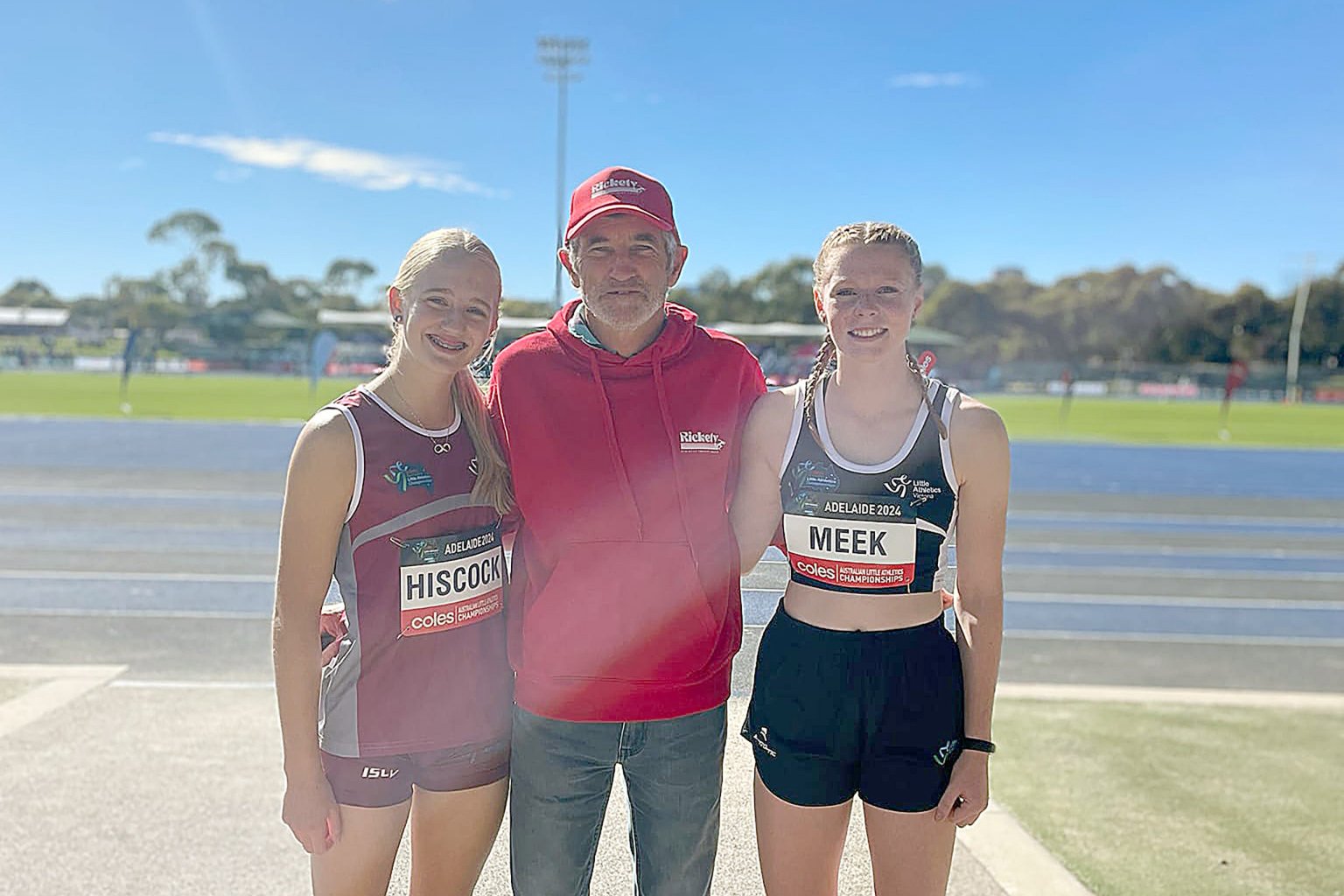 Asha Meek and Isla Hiscock with coach Ricky Price.