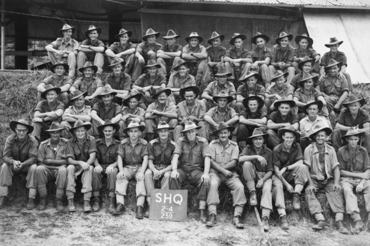 Group portrait of members of the 2/4th Commando Squadron outside unit headquarters, taken on July 3, 1945. Frederick Lyons is in the back row, third from the left.