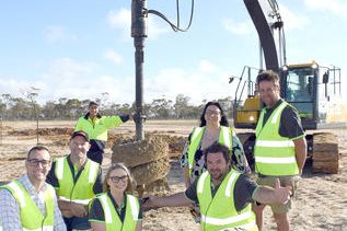 Yarriambiack Shire acting-chief executive Tony Caccariello, QA Hay’s general manager Micha Mueller, QA Hay’s Rebecca Winsall, Yarriambiack mayor Cr Kylie Zanker, Scott Somers, and site supervisor Jarryd Williams are on site while Justin Watson mans the drill in preparation for the concrete pour. CREDIT David Ward