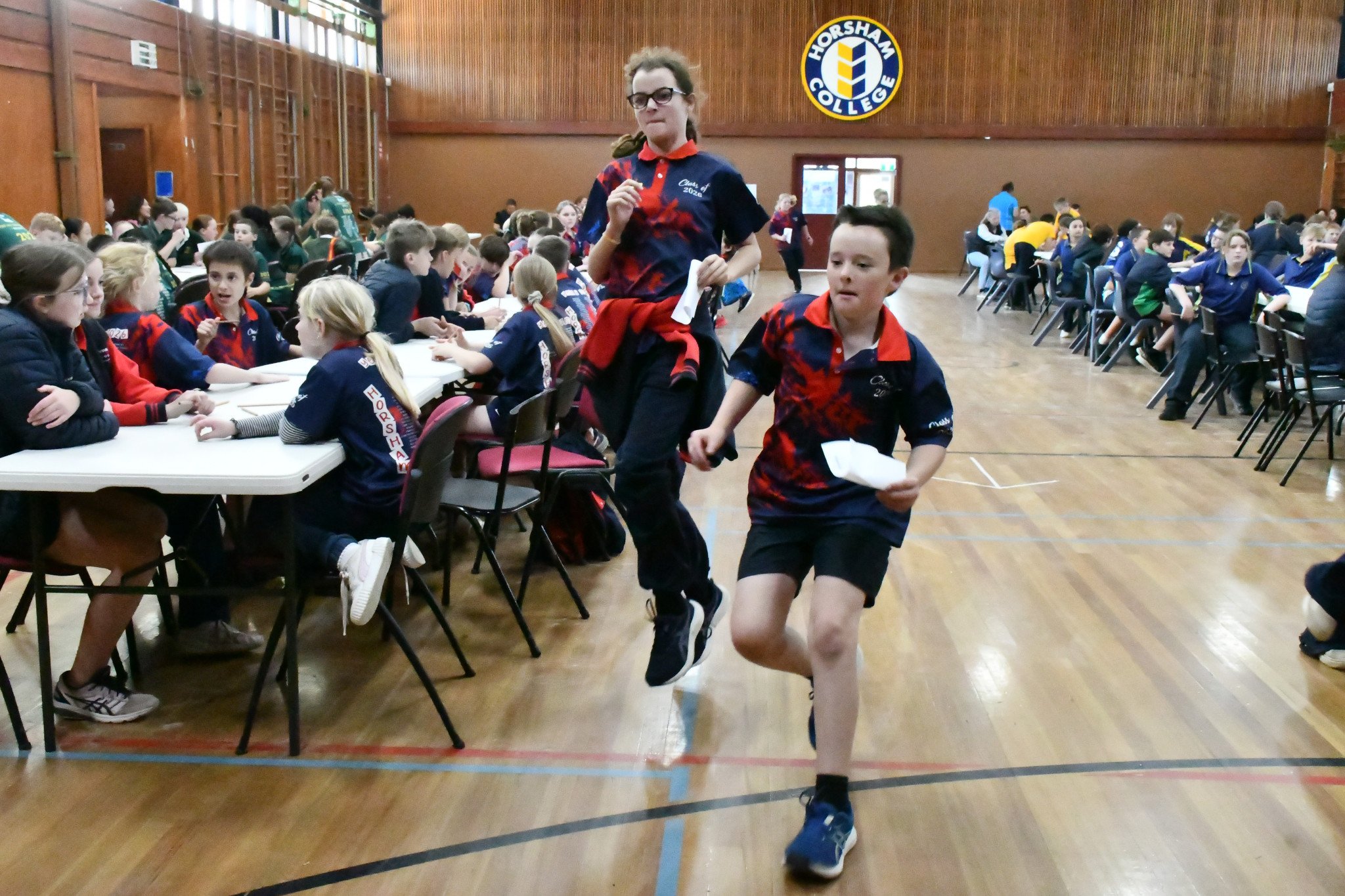 Horsham Primary School students Tiesha and Jack running back to submit their answers.