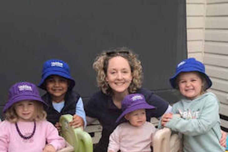Hadley Mines, Arjun Ahlawat, Winnie Wilde (on the slide) and Montana Mattschoss with Catherine Sostheim.
